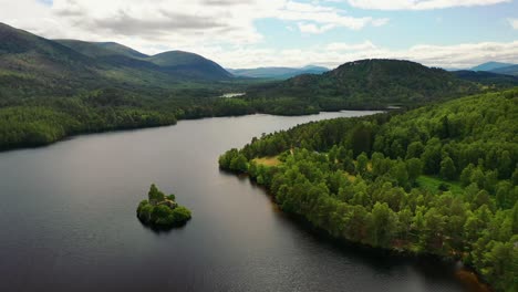 Scotland-from-the-Sky:-Loch-An-Eilein-and-Castle-Ruins-surrounded-by-Scots-Pine-Forest-in-the-Cairngorms---An-Aviemore-Aerial-Revelation,-Scotland,-United-Kingdom