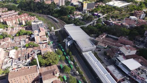 Aerial-view-of-Medellin's-Comuna-13-with-Metrocable-station-and-urban-landscape,-Colombia