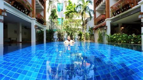 man in a swimming pool in southeast asia