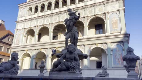 ornate fountain and historical building in european city