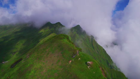 Landscapes-of-Nepal,-greenery,-clouds-covered,-blue-sky,-sunny-and-gloomy-nature,-drone-shot,-ridges,-hills,-greenery-and-peaceful-adventurous-tourism-place-4K