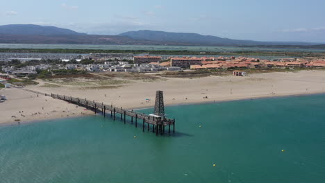 Flying-around-Port-Leucate-ponton-wooden-bridge-oversea-mediterranean-shore