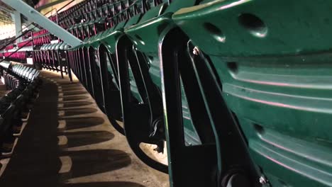 green chairs in a stadium.