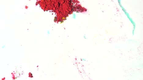 colorful powder splatters on white background