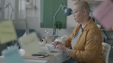 woman working at a computer in a modern office