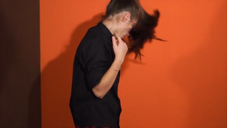 woman posing in studio with black shirt
