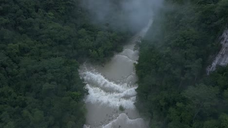 top down view of semuc champey waterfall during rainy season, aerial
