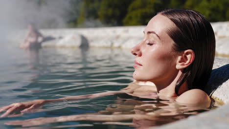 group relaxing in a mountain hot spring