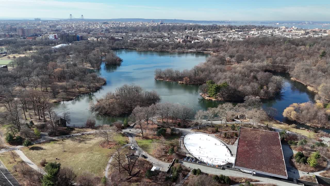 Horizontal drone pull-away shot over Ocean Ave in Brooklyn, capturing New York’s vibrant skyline, urban architecture, and charming streets as the camera smoothly retreats for a wider view.