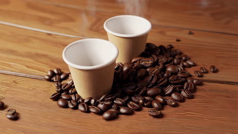 close-up of roasted coffee beans with cups and a bowl on wood