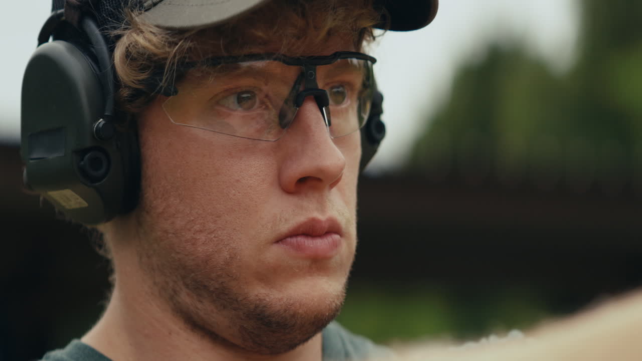 Man Wearing Safety Gear at Shooting Range