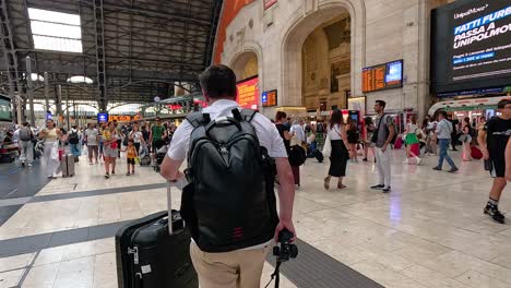 passengers navigating a crowded train station