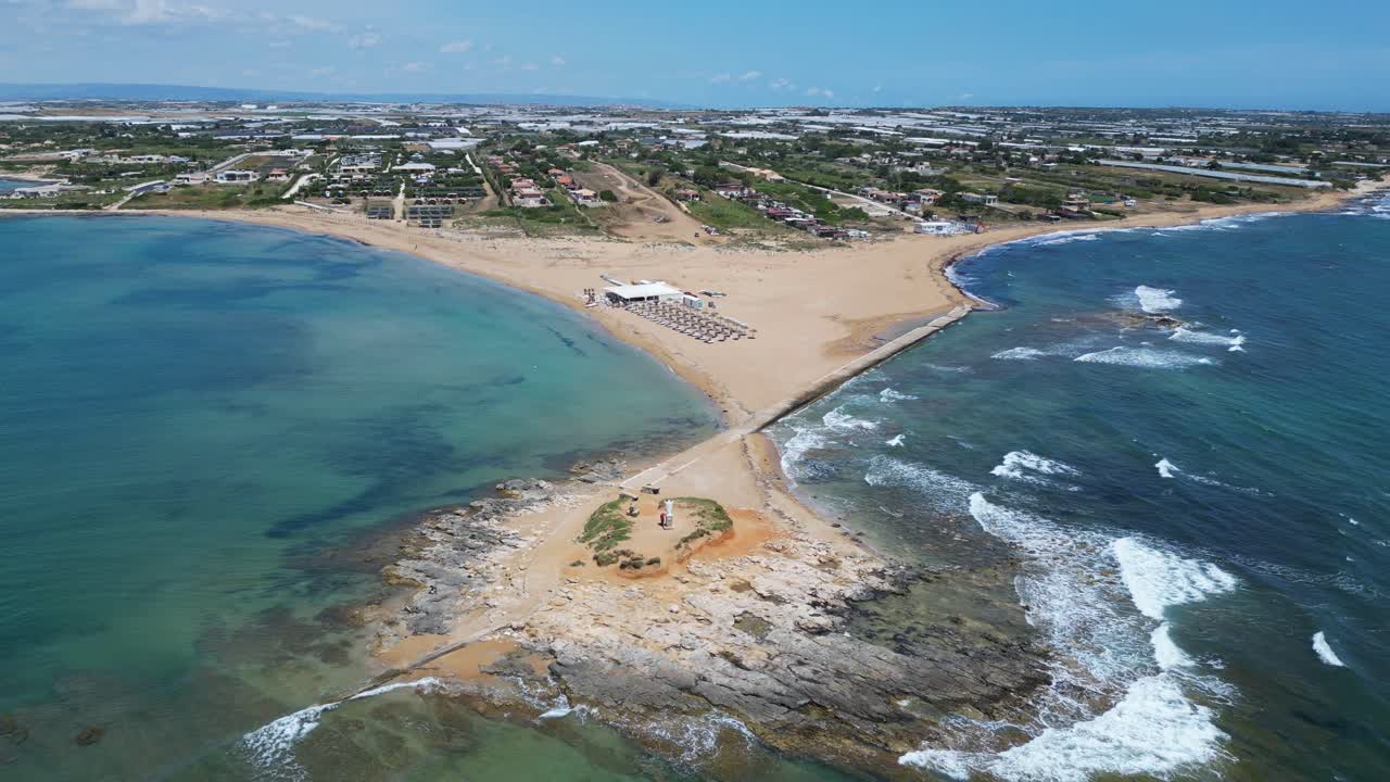 Aerial drone footage of Isola delle Correnti, Sicily: southernmost point of Italy where Ionian and Mediterranean seas meet. Perfect for travel, nature, and cinematic seascape projects