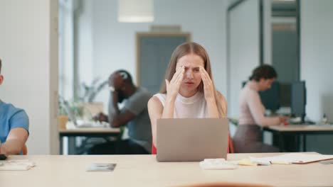 business woman getting bad news on laptop in office. freelance woman working