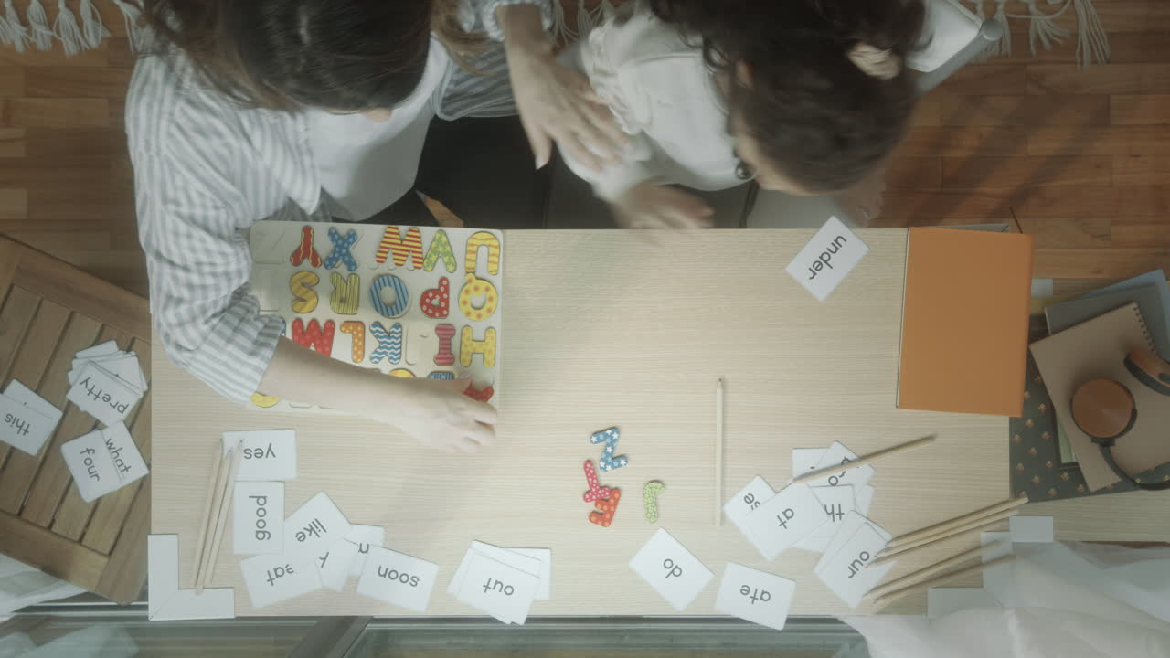 Time Lapse of Mother Helping Little Daughter with Learning Alphabet