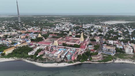 aerial view of coastal city with temple in india