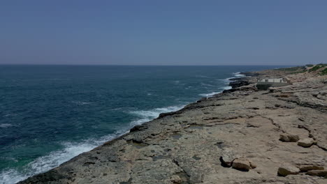 the black gulf rocky seashore towards the sea, aerial shot