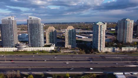 residential growth and development along highway 401 in toronto, ontario, canada showing heavy traffic during rush hour commute