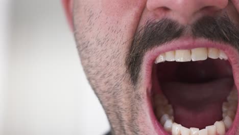 a man opens his mouth to scream in a speed ramped clip