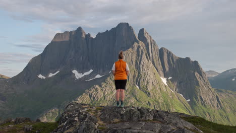 woman hiking in lofoten mountains, norway