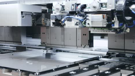 automatic machine processing sheet metal in high tech workshop, parallax left