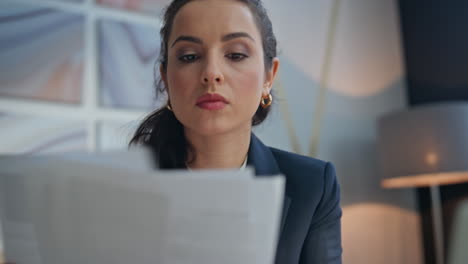 closeup woman hands writing notes at office desk. serious lady taking documents
