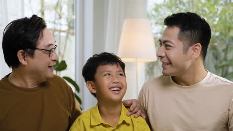 asian men and boy in the living room