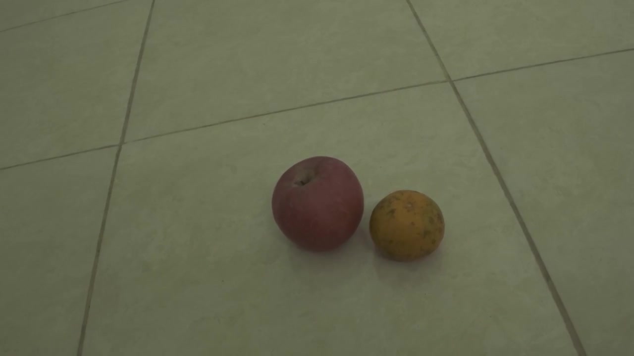 Person Removing Fresh Fruit From Tiled Floor