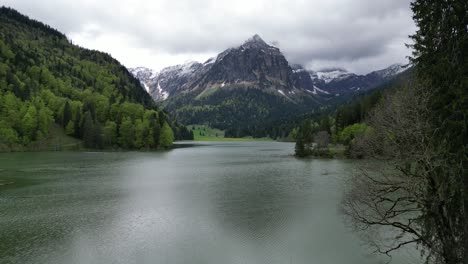 serene obersee lake surrounded by swiss alps landscape,pushin shot