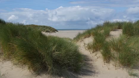 Windy-day-at-Barmouth-Beach,-Empty-Sand-Dunes-looking-towards-the-Llyn-Peninsula,-Wales,-UK-20-Second-version