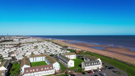 Aerial-drone-footage-of-the-famous-Butllins-holiday-camp-based-in-the-seaside-town-of-Skegness-Lancashire,-UK