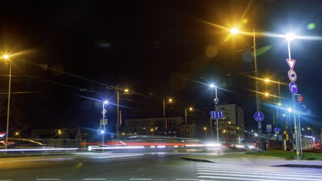 timelapse of city rush hour traffic over the liepaja tram bridge, city landscape, traffic light streaks, fast moving trams and pedestrians, wide shot