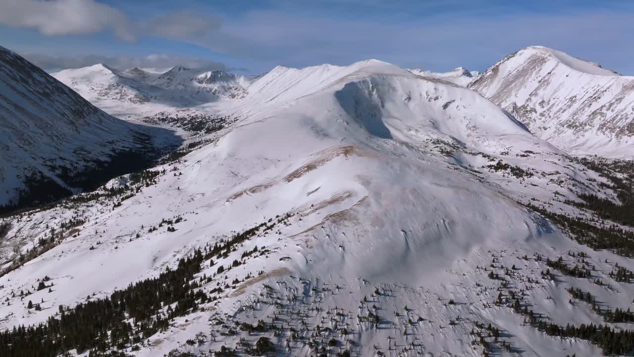 Quandary Peak Hoosier Pass Breckenridge Colorado aerial drone winter wilderness high alpine treeline Alma Fairplay Blue River Rocky Mountains morning blue sky 14er December January forward pan up