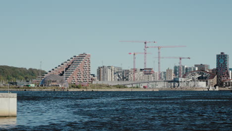 construction site and cityscape by the water