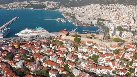 Aerial-Point-of-Interest-Shot-of-Kavala-Old-Town-Fortress-and-Port-with-Cruise-Ships,-Cinematic-4K-Footage