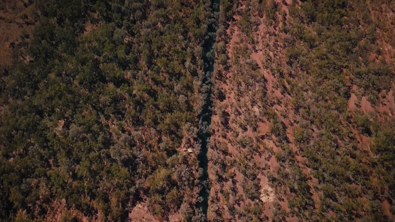 Aerial Drone elevating through Australian Desert Oasis Inland river