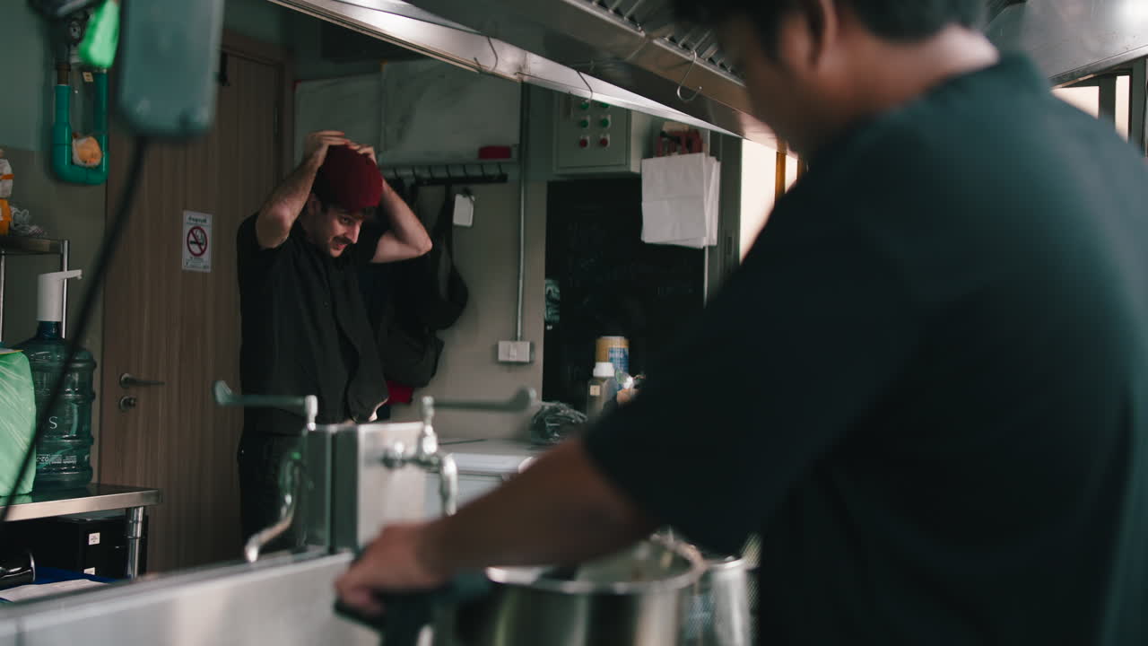 Commercial kitchen scene with chefs