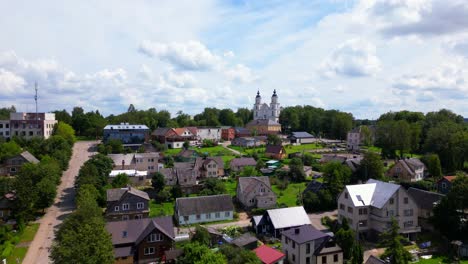 aerial view of zarasai’s old town with traditional wooden houses, narrow streets, and church towers surrounded by greenery. shot in zarasai, lithuania (zarasai, lietuva)