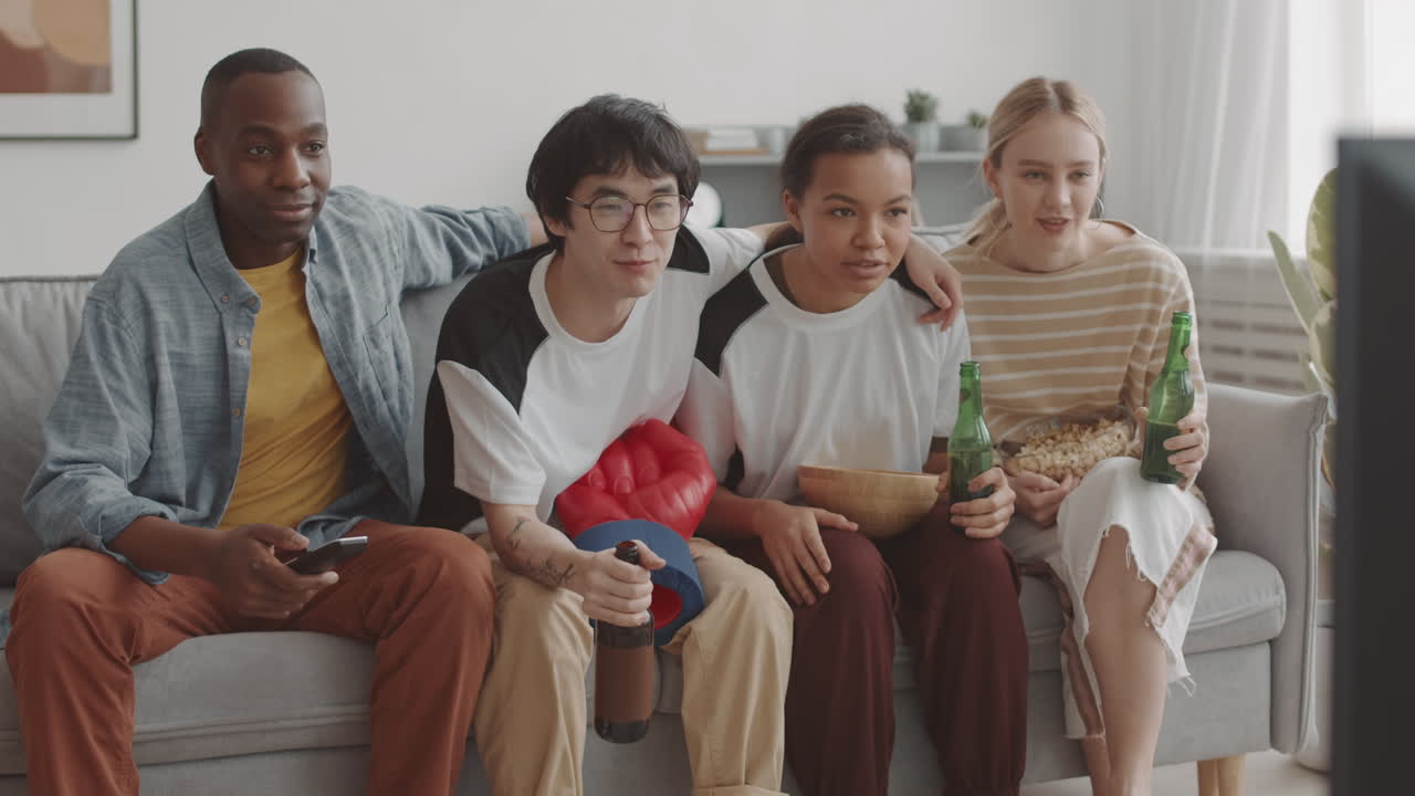Happy Friends Sitting on Sofa