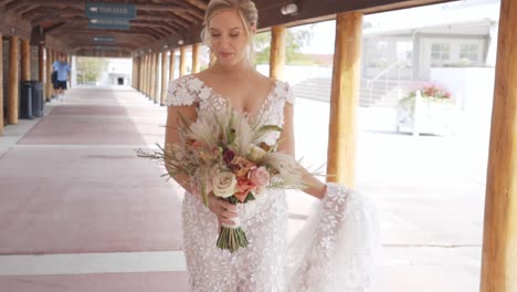 Bride-laughed-happily-while-walking-down-the-street