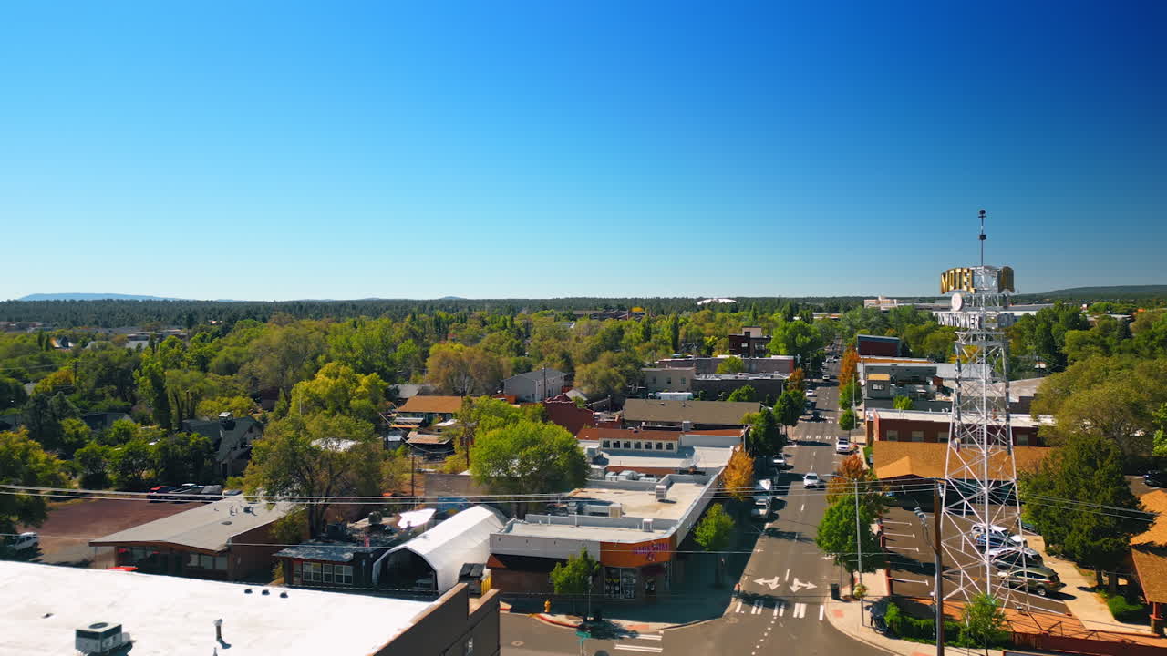 Flagstaff, USA, 24 August 2025: Flying over the green cityscape of Flagstaff, Arizona, USA. Drone footage on a clear sunny day