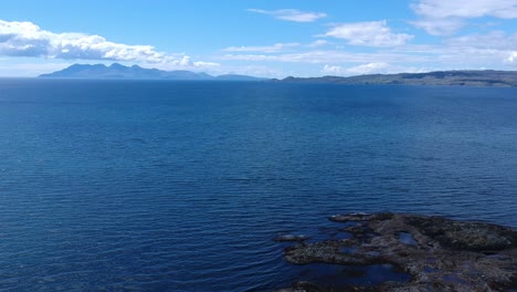 tilt-down revealing drone shot of blue ocean