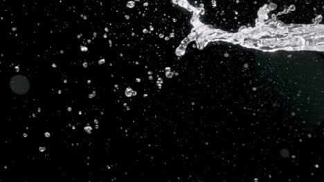 spraying water on a black background