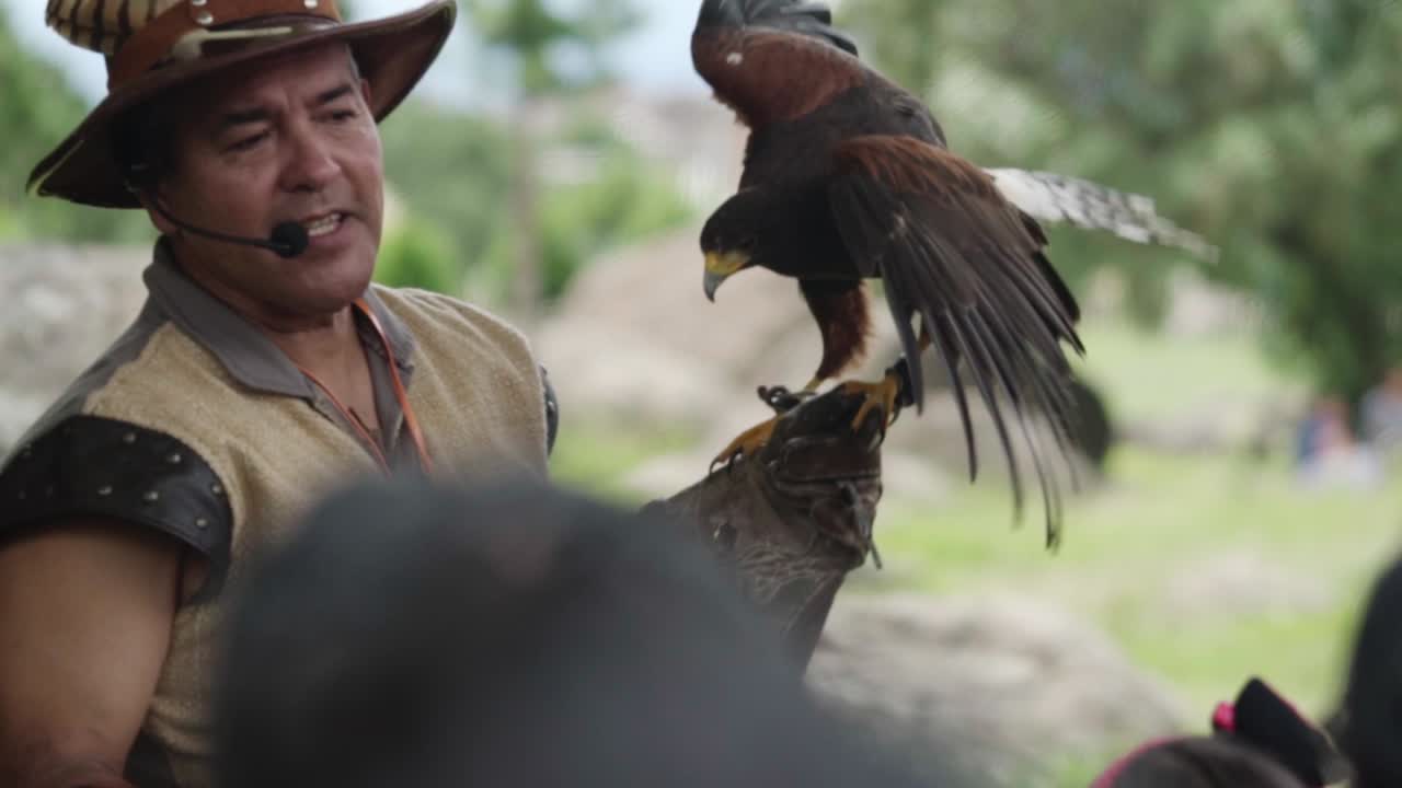 Falconry enthusiast sharing his knowledge through a talk