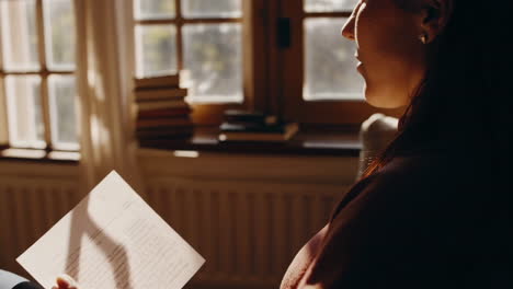 woman reading by a window