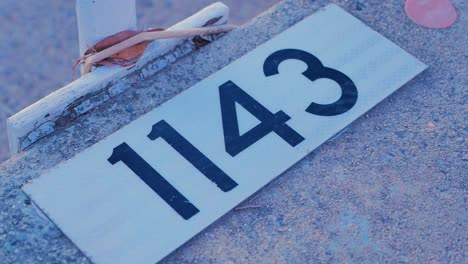 number tag labelled on the concrete