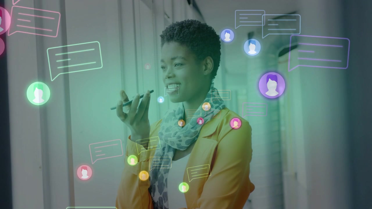 Marketer speaking into phone in hall, causing chat bubbles avatars appearing around for team chat