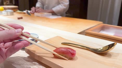 chef skillfully prepares and presents sushi nigiri