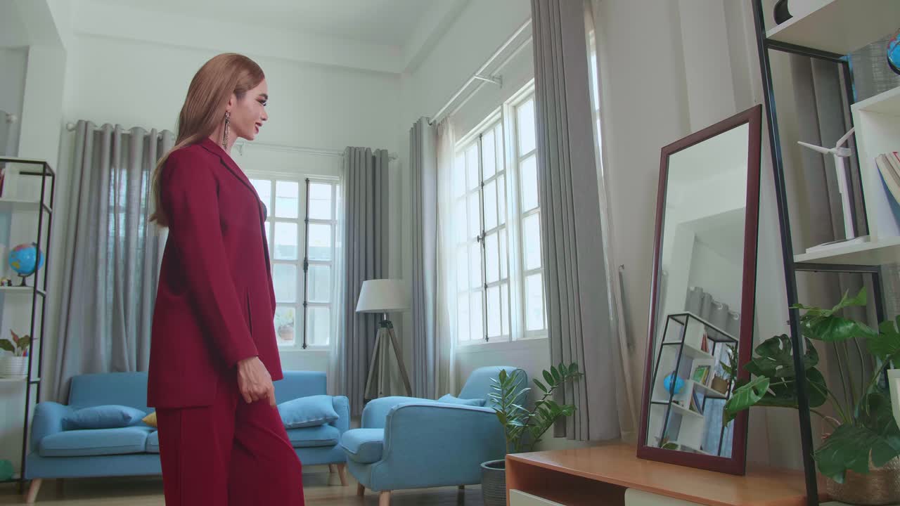 Asian Transgender Woman Posing In Front Of Mirror Wearing A Red Clothes