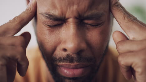 man experiencing headache